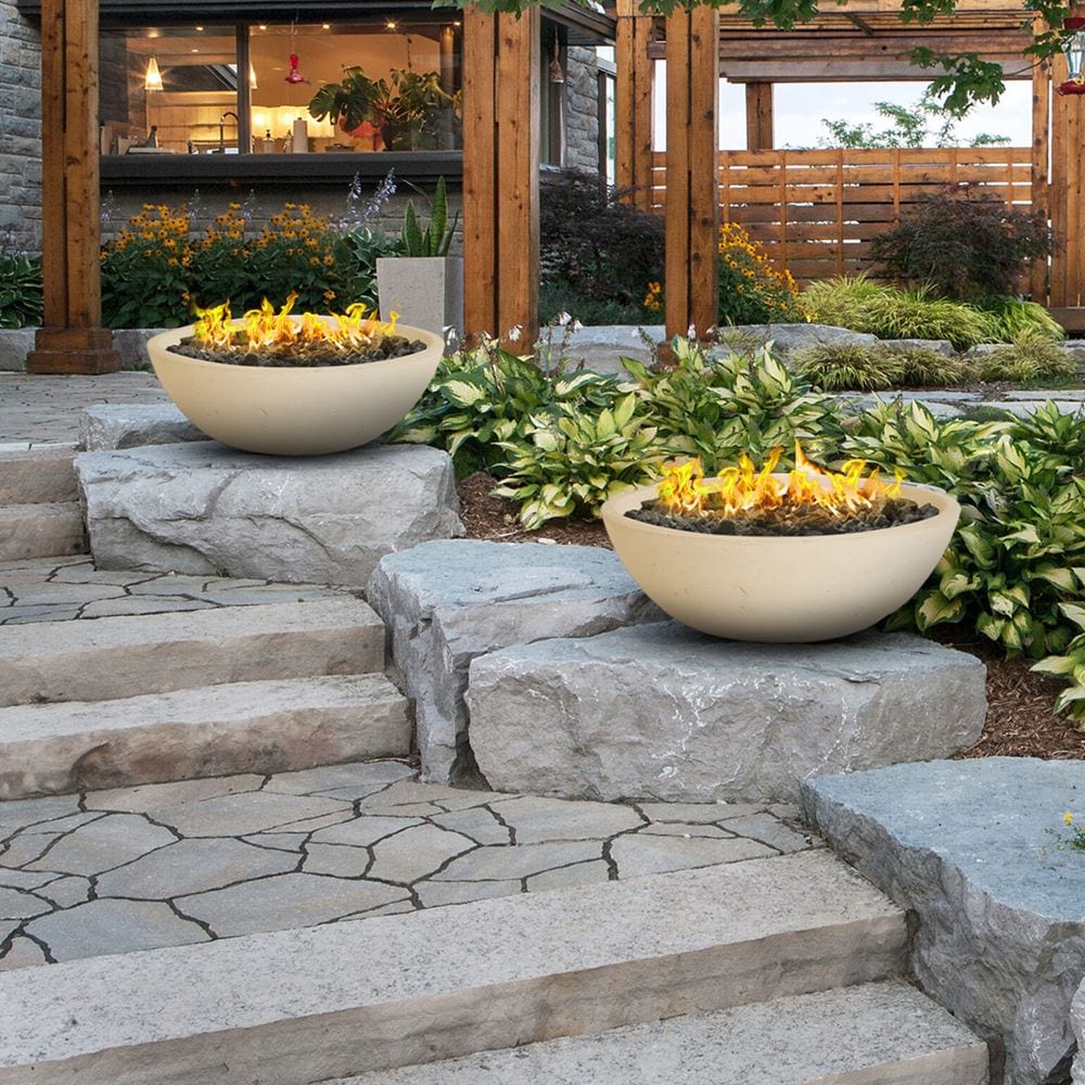 beige gas fire bowls placed near the steps for warm and inviting ambiance
