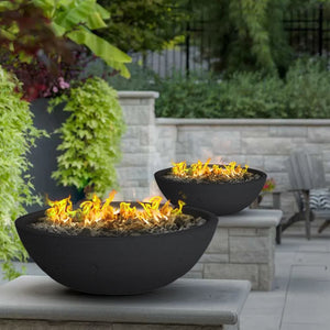 black gas fire bowls placed on columns to enhance the ambiance outdoors