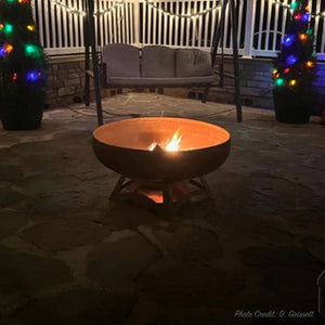 Ohio Flame Liberty Round Steel Fire Pit with Hollow Base in a backyard by the swing