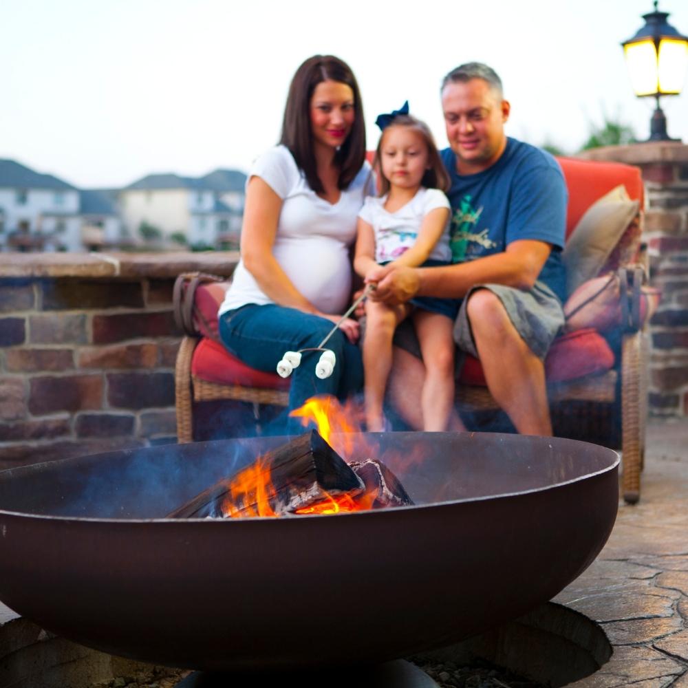 Family Roasting Marshmallows on Fire Pit