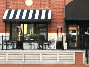 Paragon Outdoor Inferno Flame Tower Patio Heater at a cafe's outdoor area