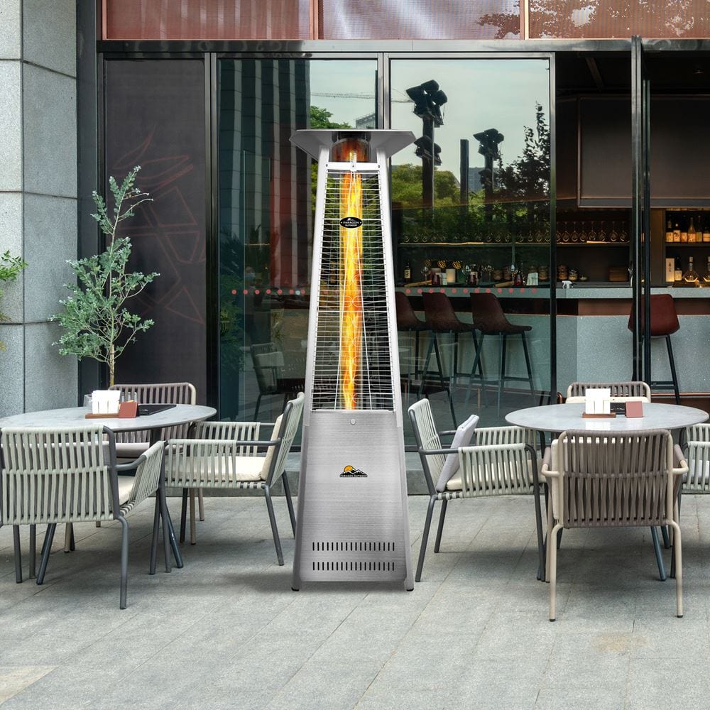 Paragon Outdoor Vesta Flame Tower Patio Heater in Stainless Steel on a restaurant&#39;s patio