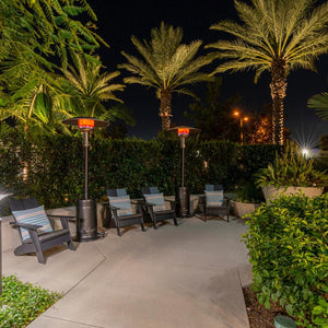 patio comfort jet silver propane patio heater under some palm trees