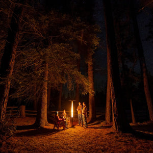 gathering around the patiofyre metro jetlamp pellet patio heater in the woods