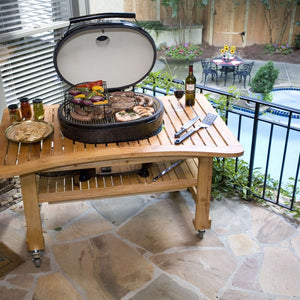 Primo's 24-Inch Ceramic Kamado Egg Charcoal Grill on a table