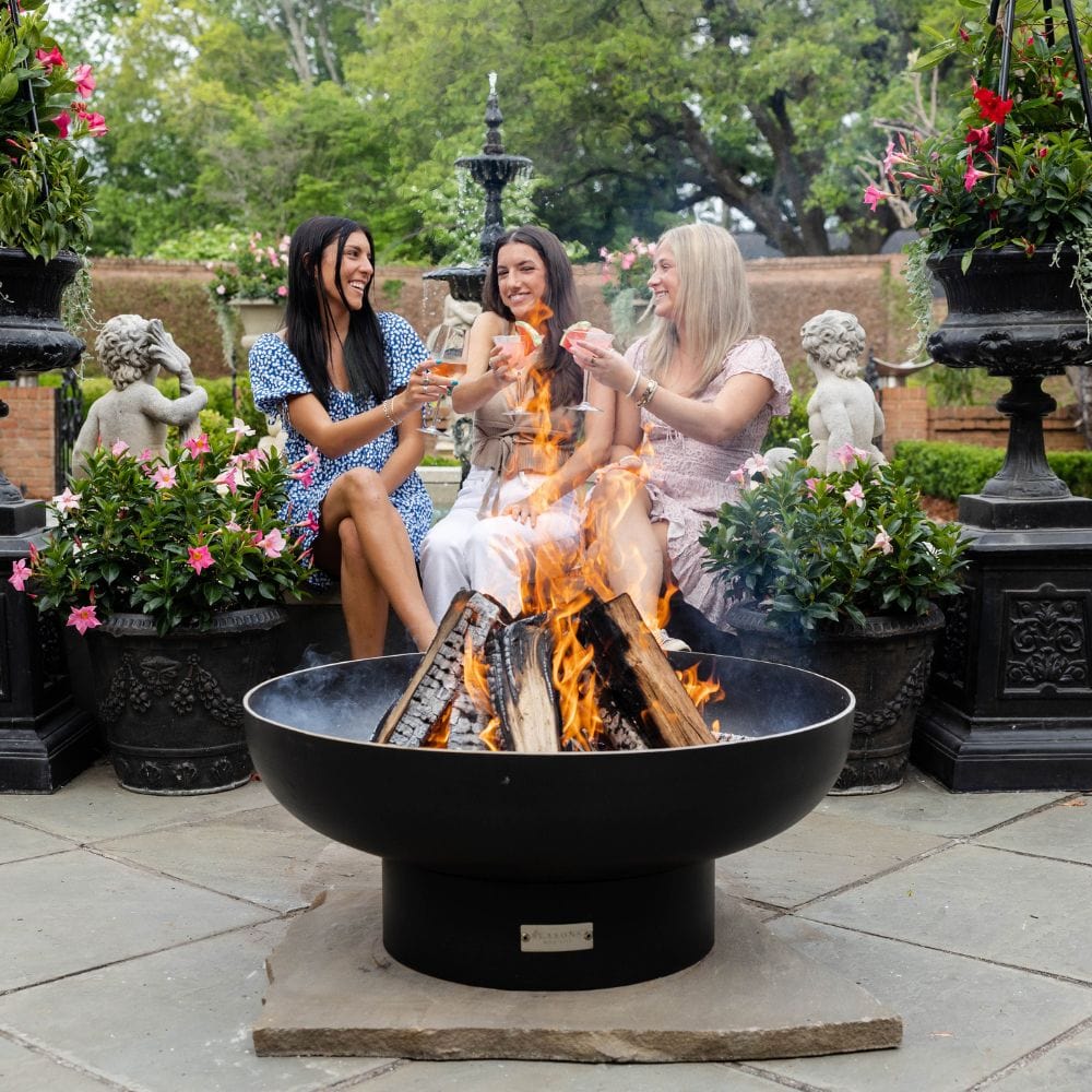 enjoying cocktails by the seasons fire pits elliptical steel fire pit