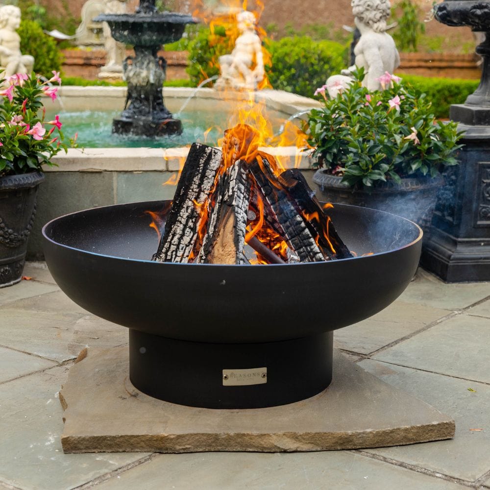 seasons fire pits elliptical steel fire pit on a paver - angle view