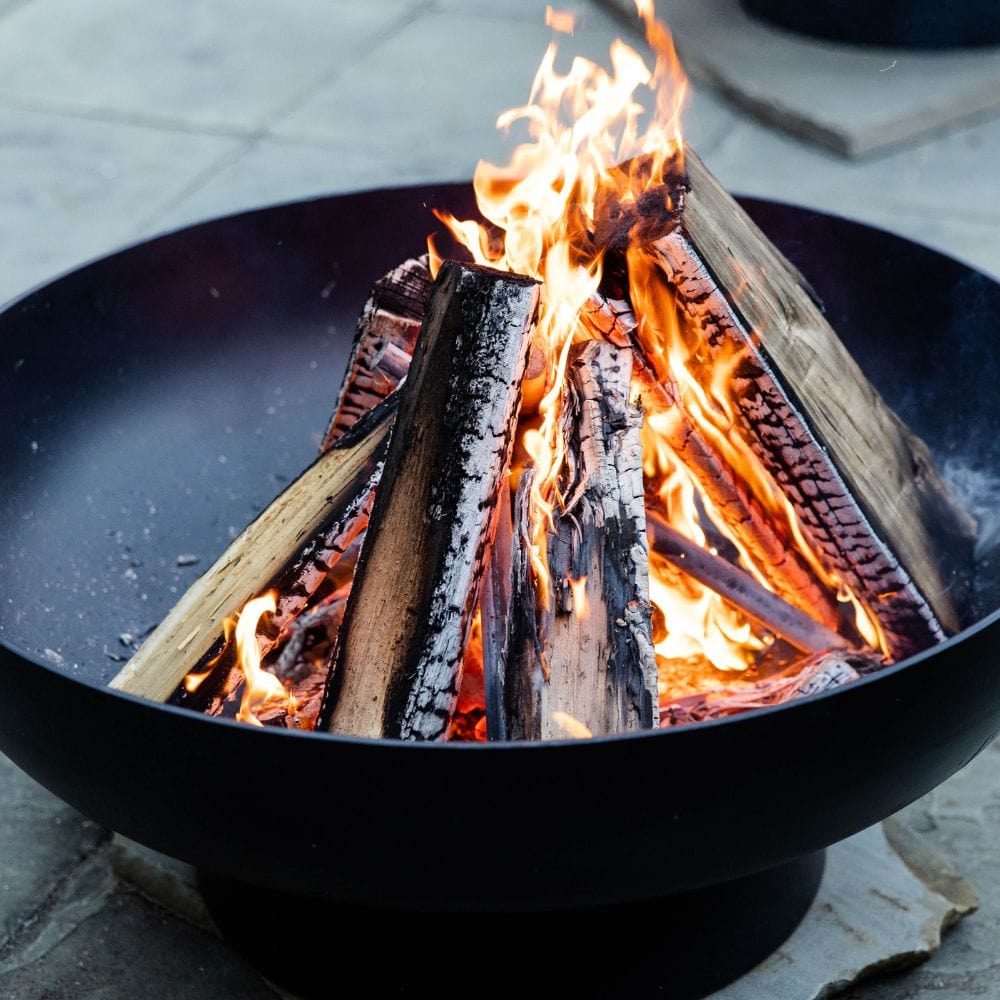 firewood stacked on the conical grate
