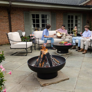 hanging out with friends by the seasons fire pits elliptical steel fire pit