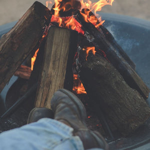 resting feet on the seasons fire pits flare steel fire pit