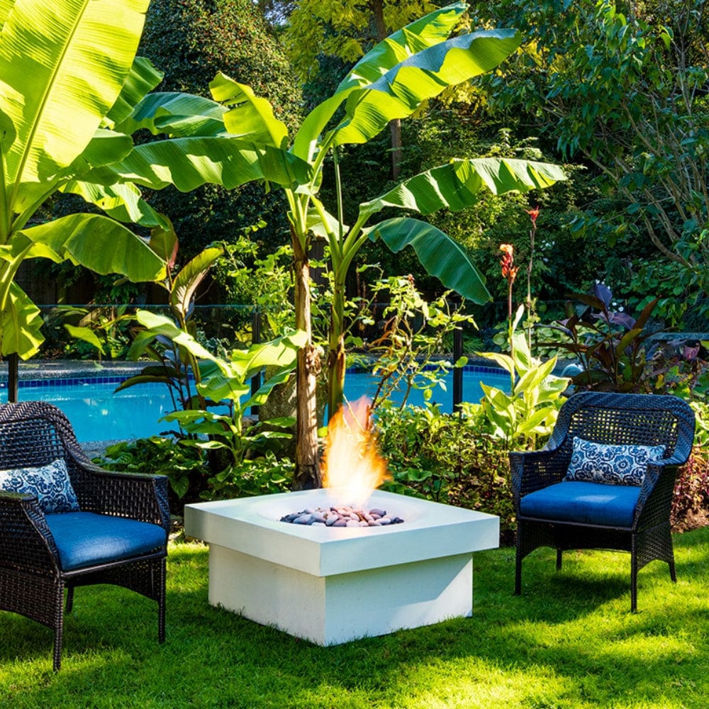 solus elevated halo square gas fire pit near some banana trees