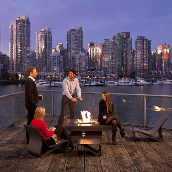 colleagues enjoying the ambiance of a solus elevated halo square gas fire pit