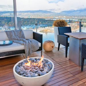 solus hemi gas fire pit on a balcony with a stunning view