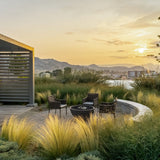 solus hemi gas fire pit in a garden - alternate view