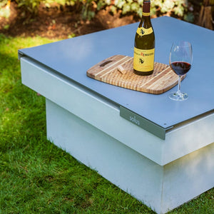 solus square metal tabletop with wine bottle on top of it