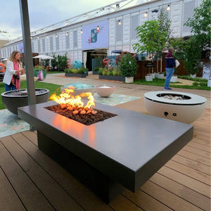 Solus Tavolo 68-Inch Linear Concrete Gas Fire Pit at a trade show