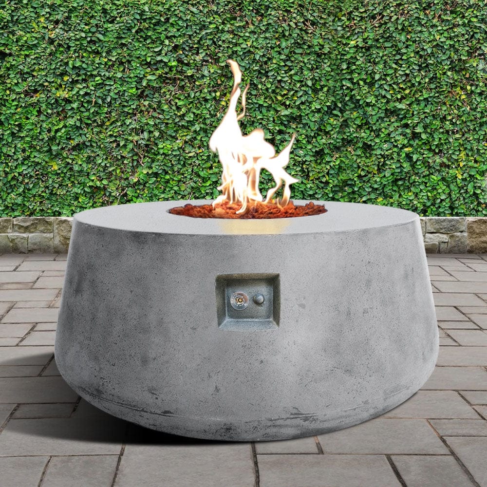 Stonelum Indiana 01 47-Inch Round White Gas Fire Pit in a garden
