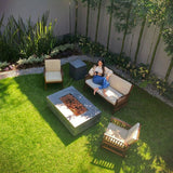 Stonelum Manhattan 01 Rectangular Graphite Fire Pit Table in a garden - angle view