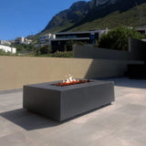 Stonelum Manhattan 01 Rectangular Graphite Fire Pit Table in a patio - angle view