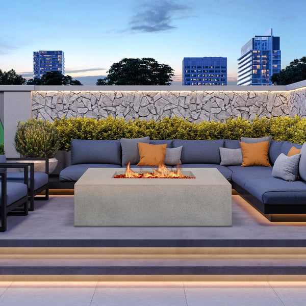 Stonelum Manhattan 04 Rectangular Grey Fire Pit on a cozy patio with a couch