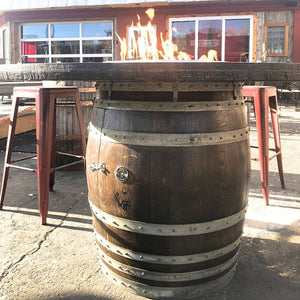 wine barrel dude full barrel gas fire pit table at a restaurant bar