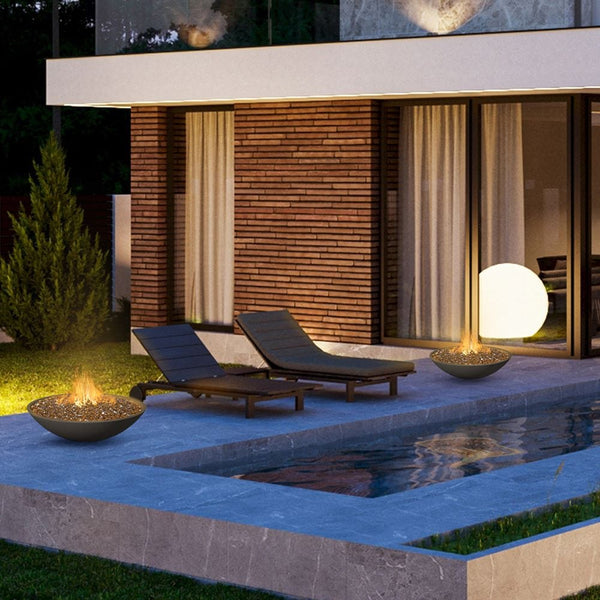 American Fyre Designs Marseille Black Lava Fire Bowl by the pool