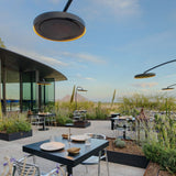 several bromic eclipse smart-heat electric patio heaters at an outdoor cafe