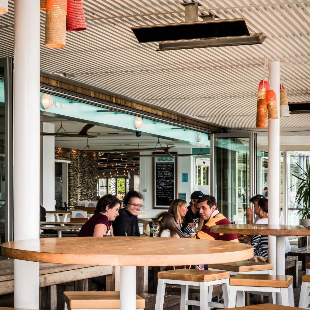 Black Bromic Platinum Smart-Heat Electric Patio Heater flush mounted in restaurant