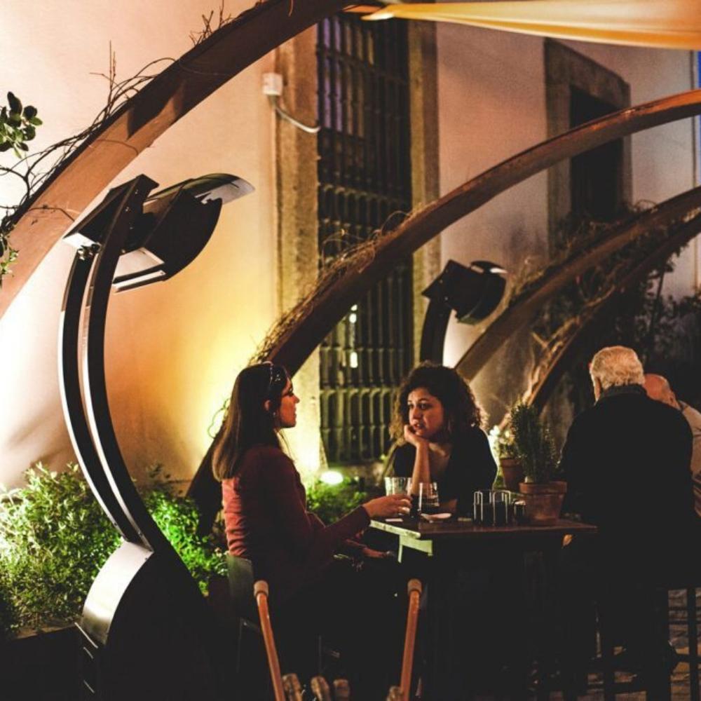 Bromic Tungsten Smart-Heat Portable Heaters Beside Table