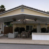 Calcana High Output Stainless Steel Gas Patio Heaters in a patio - angle view
