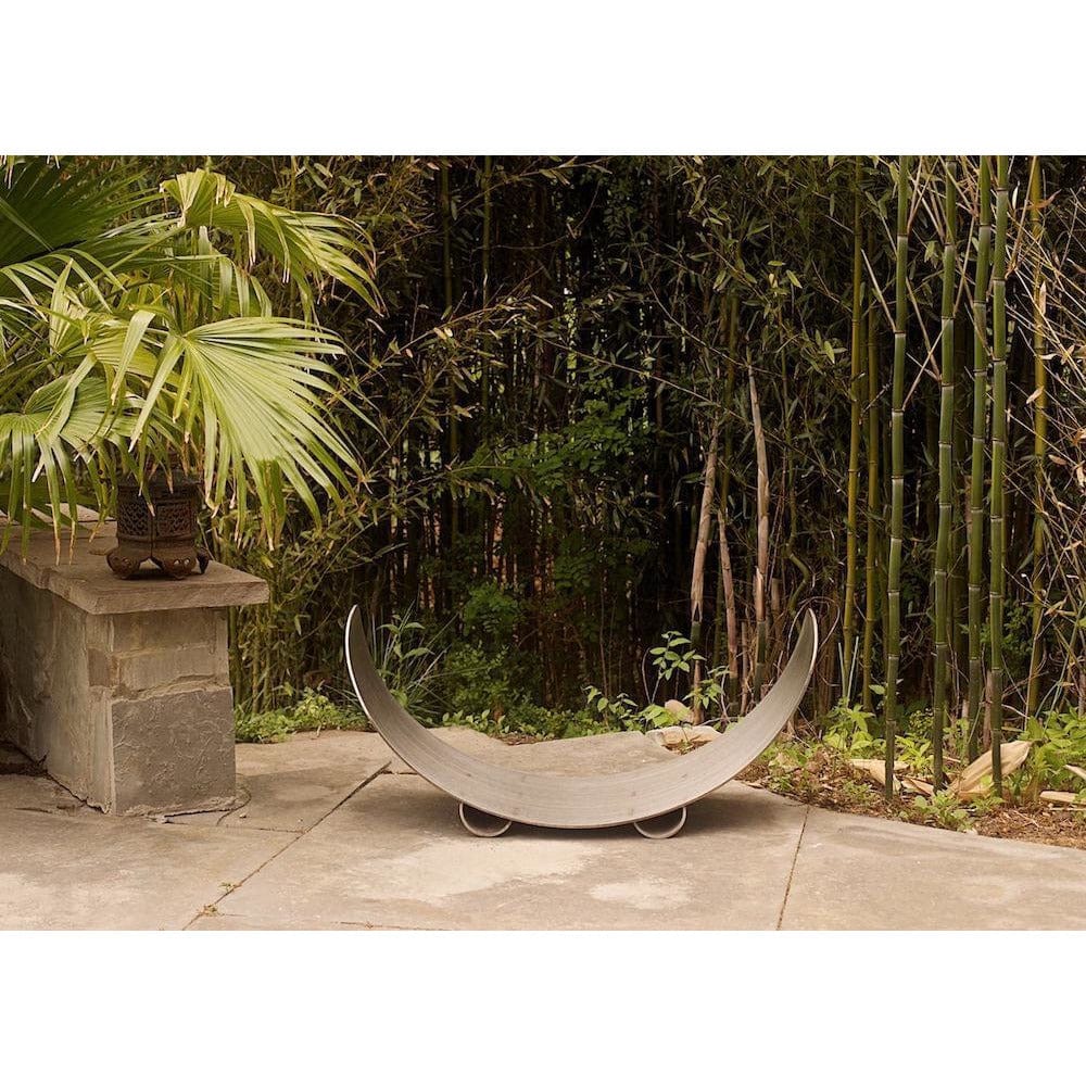 Fire Pit Art Crescent Log Rack in Stainless Steel (CRLR-Stainless) - lifestyle view
