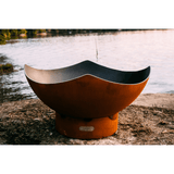 Fire Pit Art Manta Ray - 36" Handcrafted Carbon Steel Fire Pit (MR) Beside A Lake - angle view