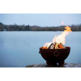 Wood Burning Fire Pit - Fire Pit Art Nepal - 41" Steel Fire Pit (NP) Lit Up Beside A Lake