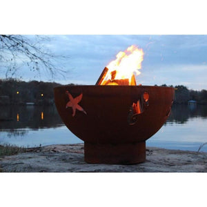 Fire Pit Art Sea Creatures - 36" Handcrafted Carbon Steel Fire Pit (SEA) Lit Up Beside A Lake