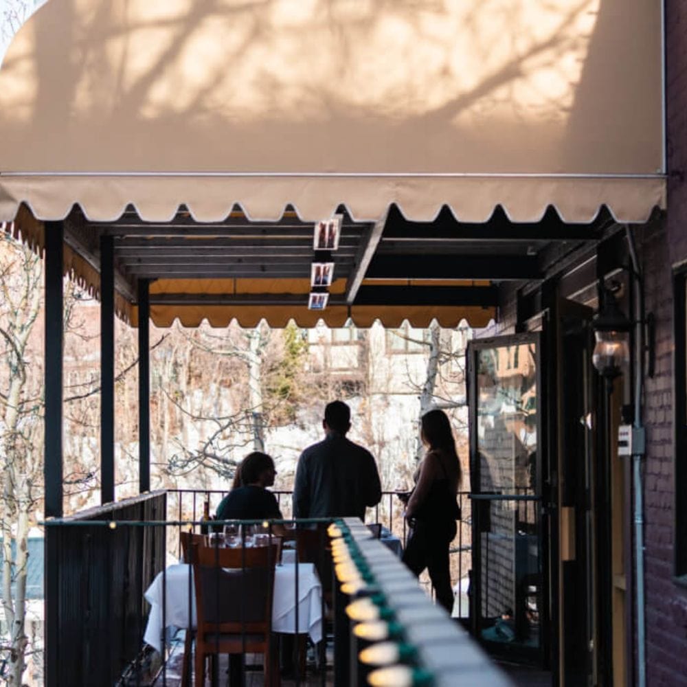 infratech sl series 63&quot; electric patio heaters at a restaurant&#39;s terrace