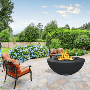 modern blaze round raven fire bowl with smooth surface in a lush garden