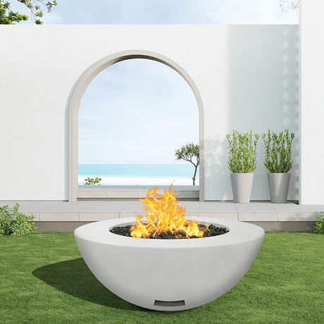 modern blaze round arctic fire bowl with smooth surface in a light outdoor setting - side view