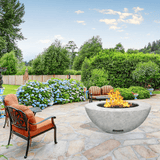 modern blaze round arctic fire bowl with textured surface in a lush garden - installation view