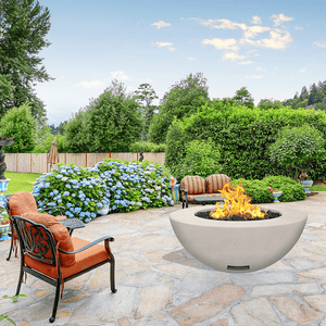 modern blaze round ivory fire bowl with smooth surface in a lush garden