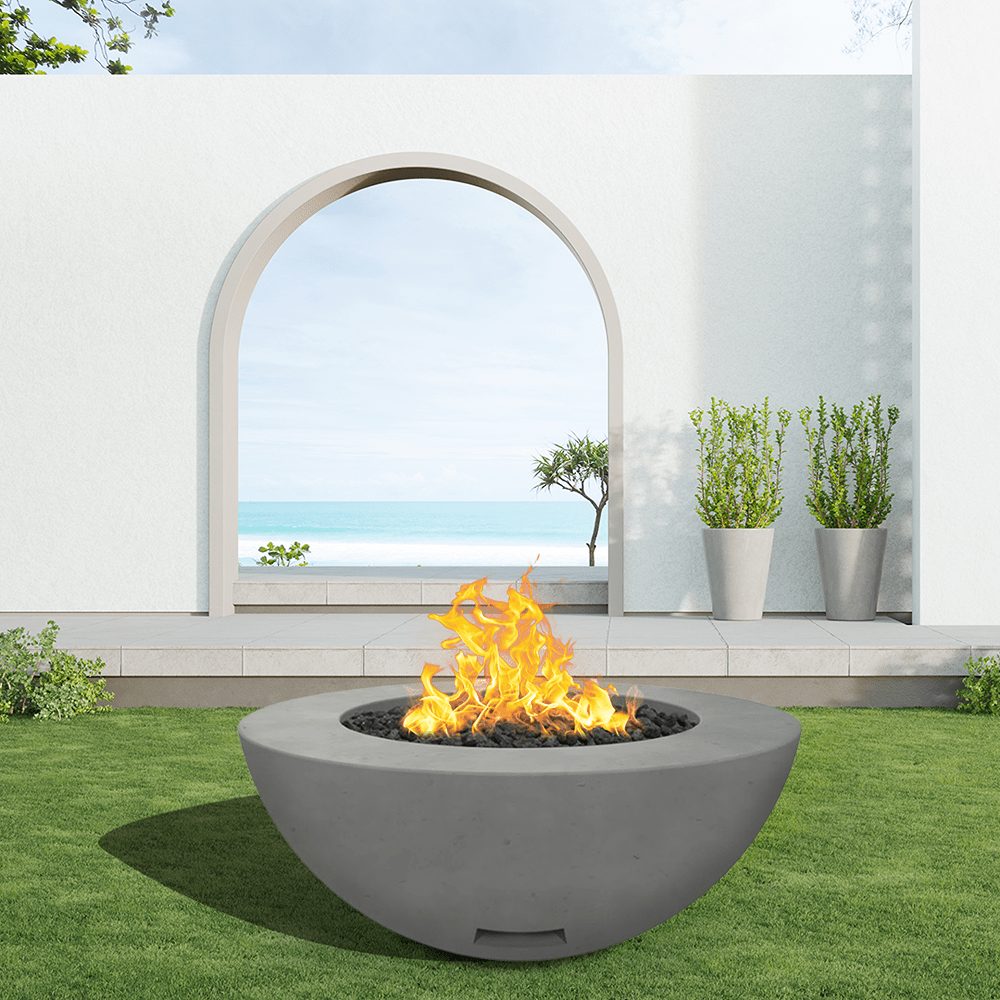modern blaze round slate fire bowl with smooth surface in a light outdoor setting - angle view