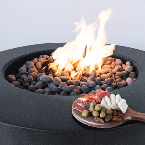 Modern Blaze Oblica Pacific Midnight Round Fire Pit burn area with vibrant flames