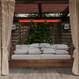 RADtec Torrid Series Infrared Electric Heater in a cozy pergola outdoor setting - side view