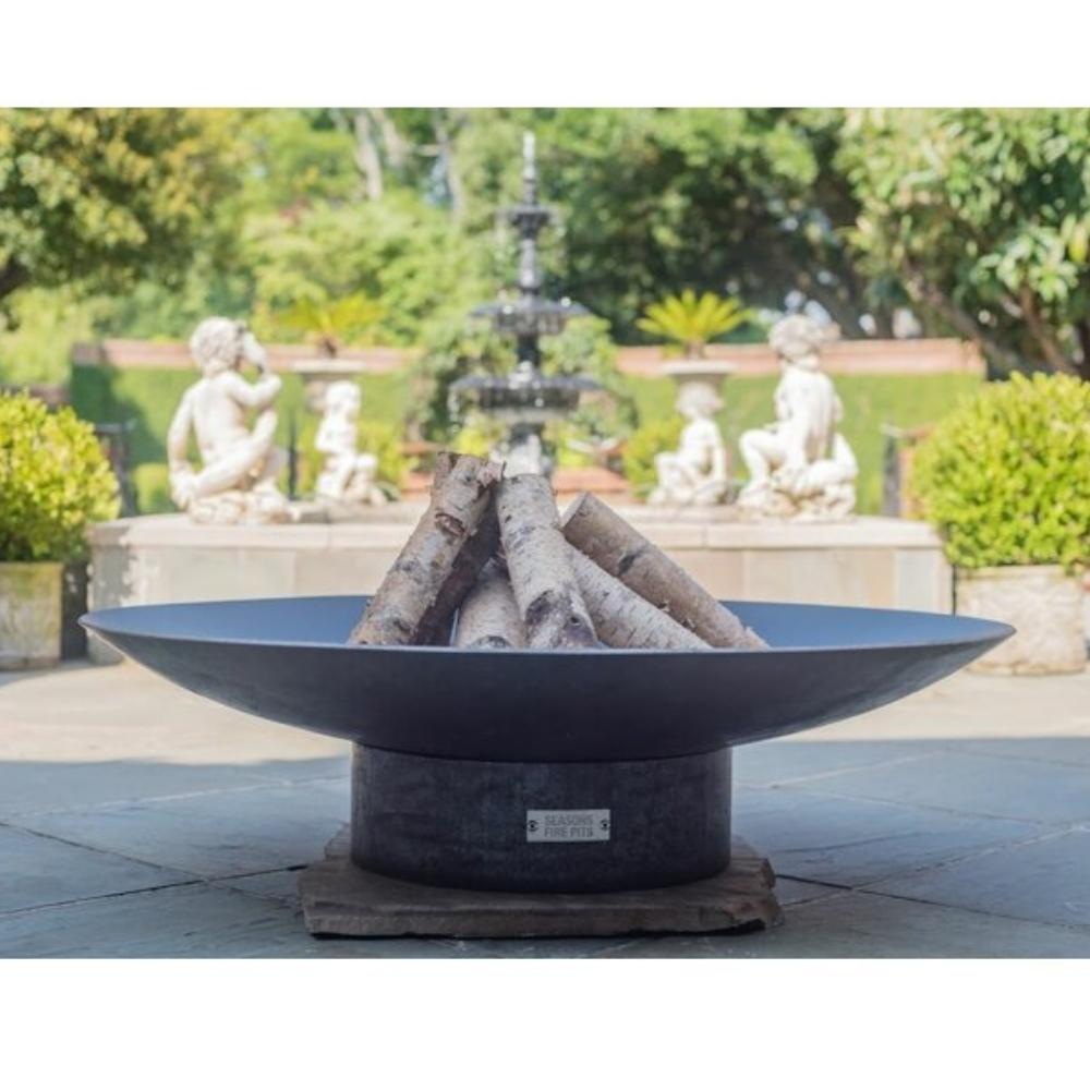 Seasons Fire Pits Concave Round Steel Fire Pit by the Fountain - angle view