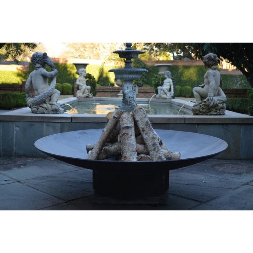 Seasons Fire Pits Concave Round Steel Fire Pit by the Fountain - angle view