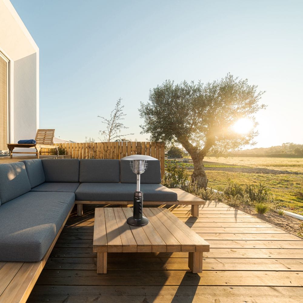 SUNHEAT Round Golden Hammered Tabletop Propane Patio Heater in an open air patio