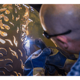 Handcrafting the art on The Fire Pit Gallery Fire Pits - angle view