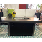 The Outdoor GreatRoom Company Caden 44" Rectangular Fire Pit Table in seating area