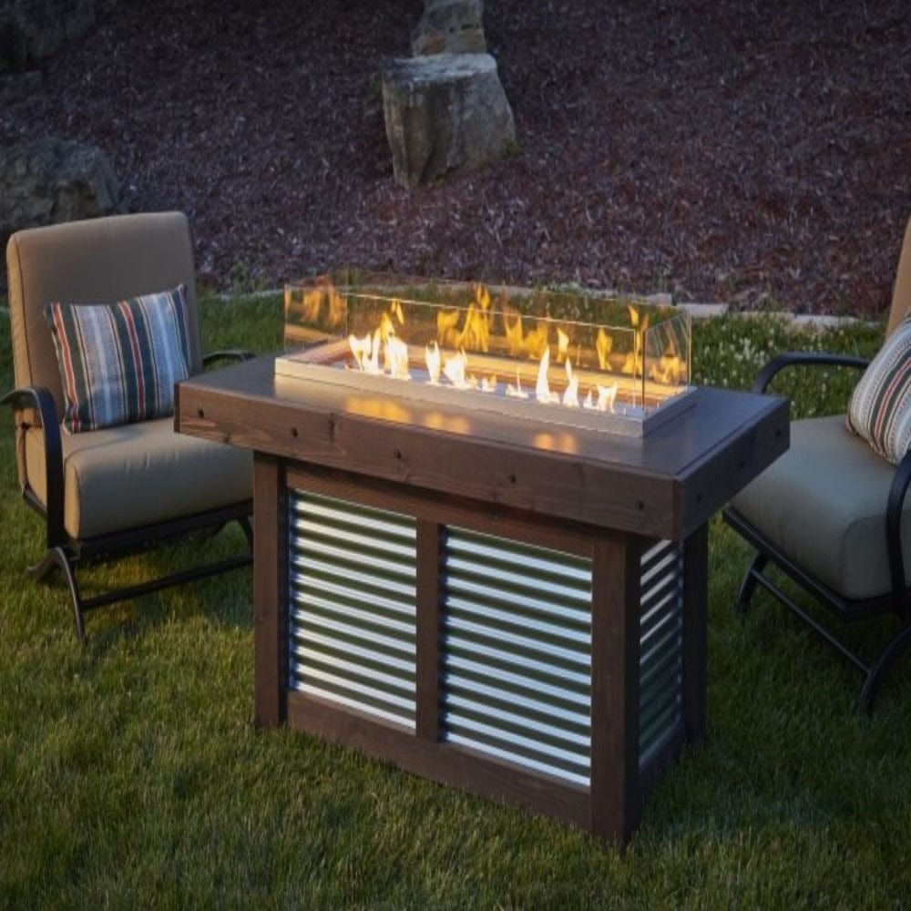 Denali Brew 57&quot; Linear Gas Fire Pit Table in back yard with wind guard