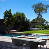 Top Fires Alameda Black and White Steel Gas Fire Pit Table in Poolside Patio