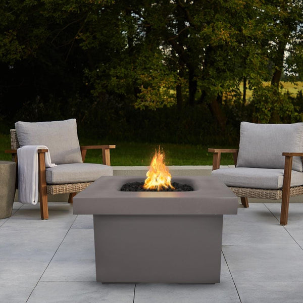 Brown Fire Pit Table with Chairs and View of Trees